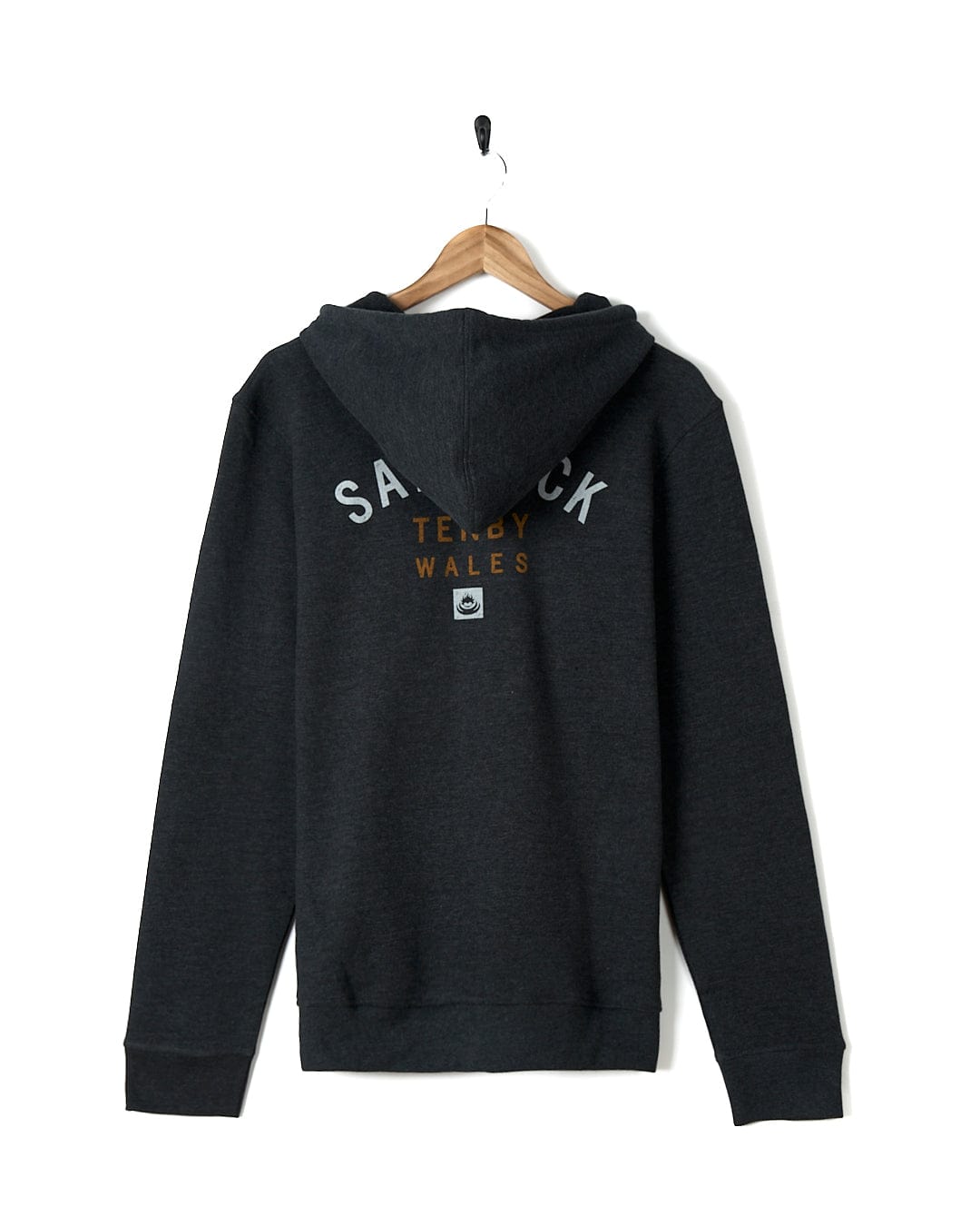 A Saltrock Location Zip Hoodie - Tenby - Dark Grey with the word sauck on it.