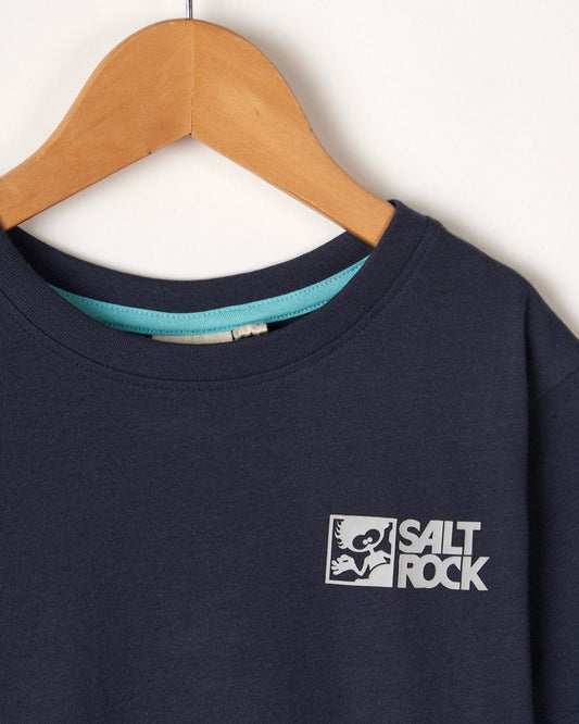 Dark blue Tok Corp basic t-shirt on a wooden hanger with a white Saltrock logo on the front left side, displayed against a plain background.