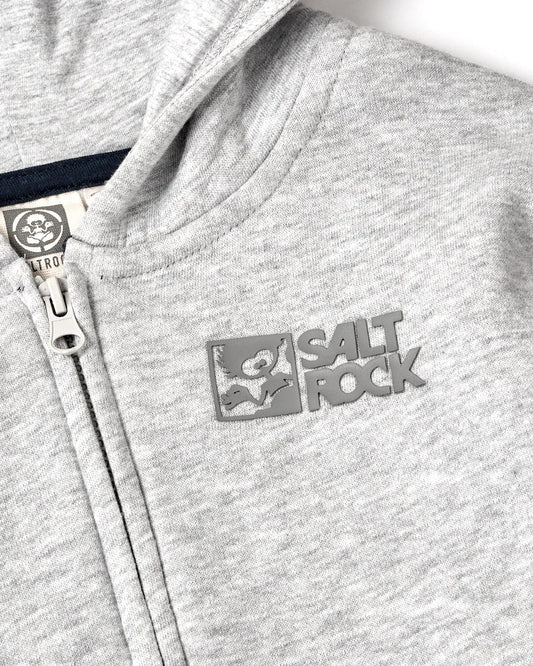 Close-up of a grey marl Saltrock hoodie with a logo patch and partial view of the Tok Corp - Recycled Kids Zip Hoodie - Grey Marl.