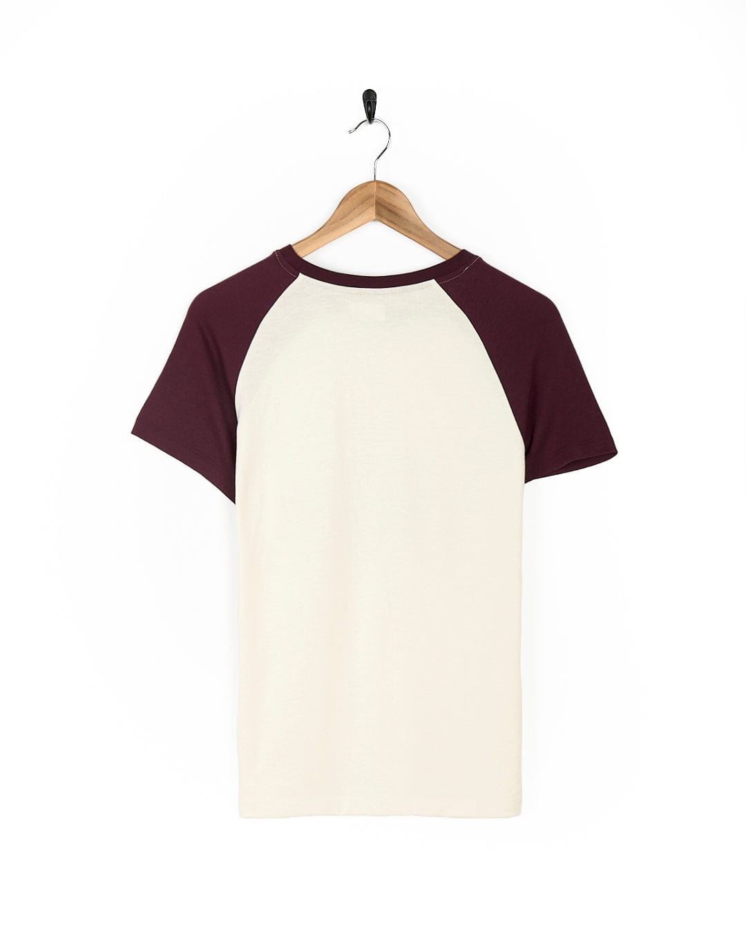 A lightweight fabric Trademark Floral - Womens Short Sleeve T-Shirt in cream, with Saltrock branding, hanging on a wooden hanger.