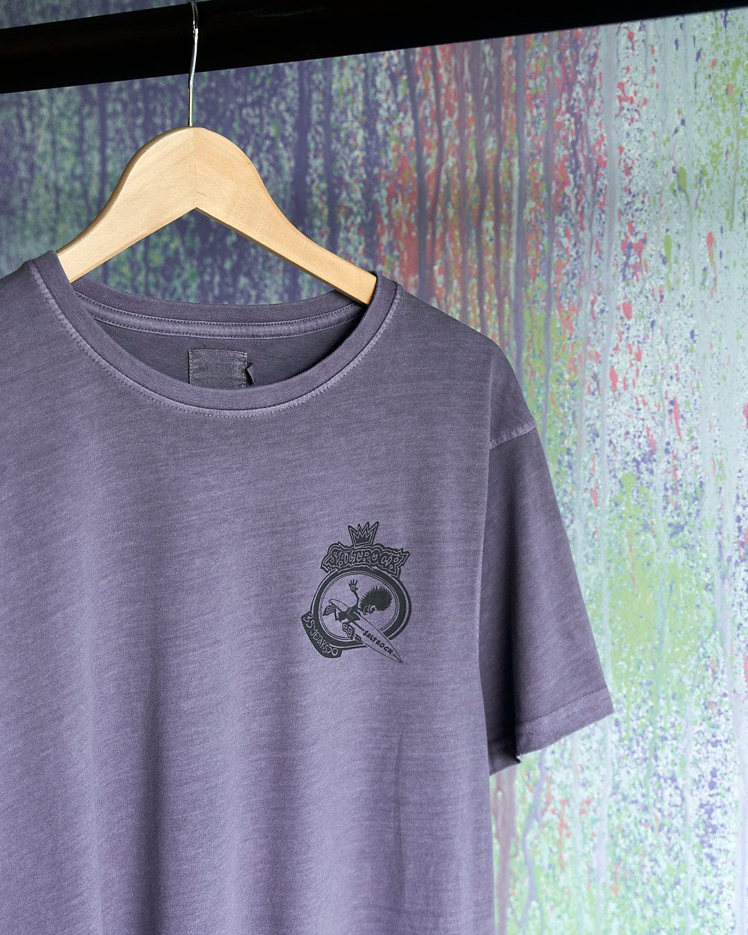 A Tribal Saltrock - Limited Edition 35 Years T-Shirt hangs on a hanger.