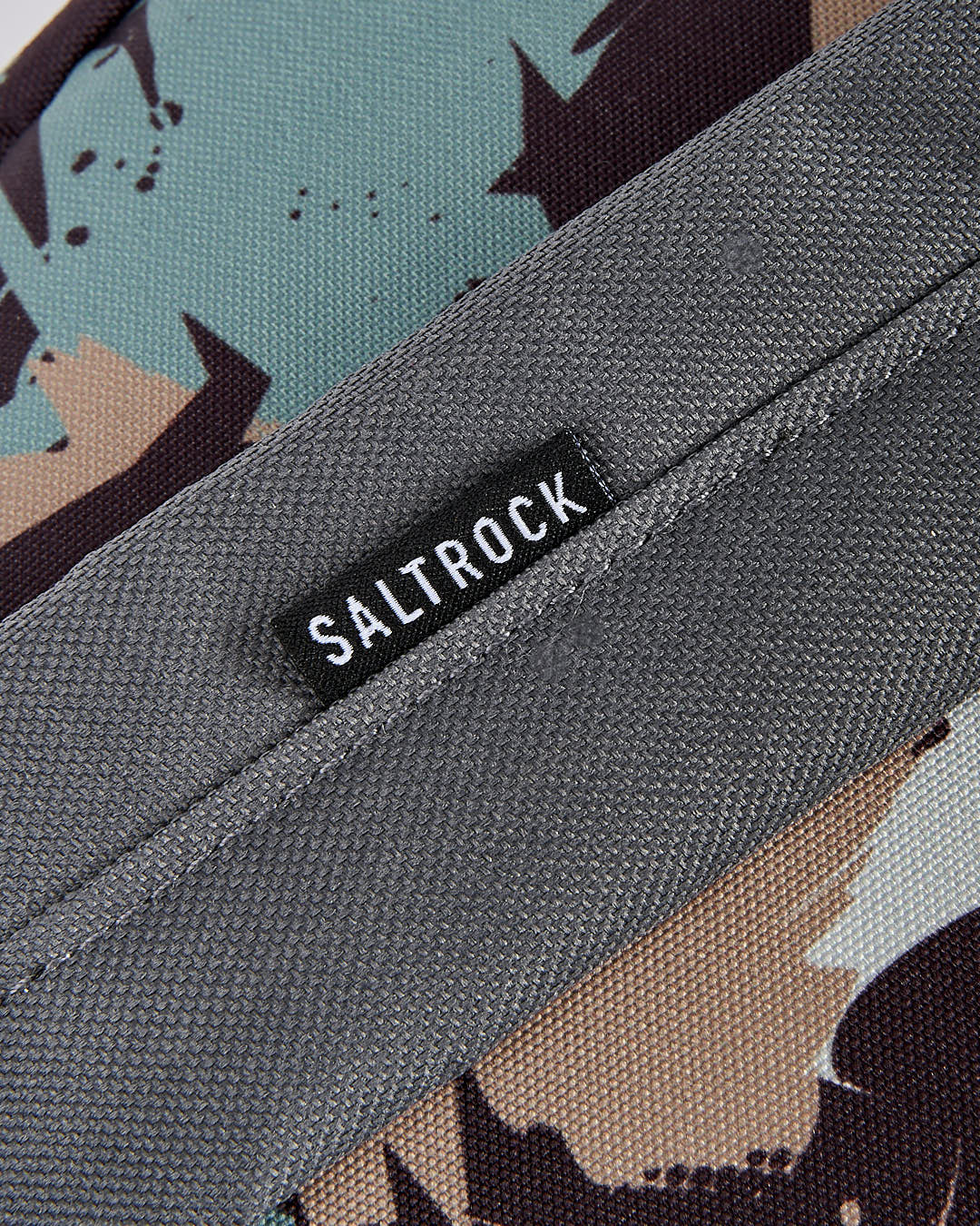 A close up of a Uni-Camo - Backpack - Grey with the word Saltrock on it.