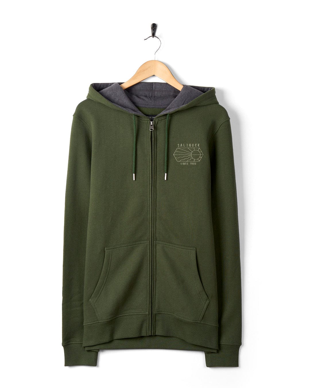 Saltrock Vantage Outline - Recycled Mens Zip Hoodie in Dark Green with gray hood lining, hanging on a wall, featuring embroidered Saltrock branding on the left chest area.