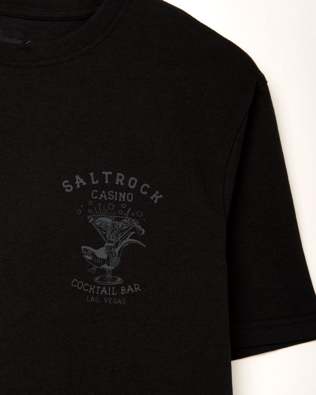 A black cotton Vegas Cocktail - Mens Short Sleeve T-Shirt with "Saltrock" printed on it.