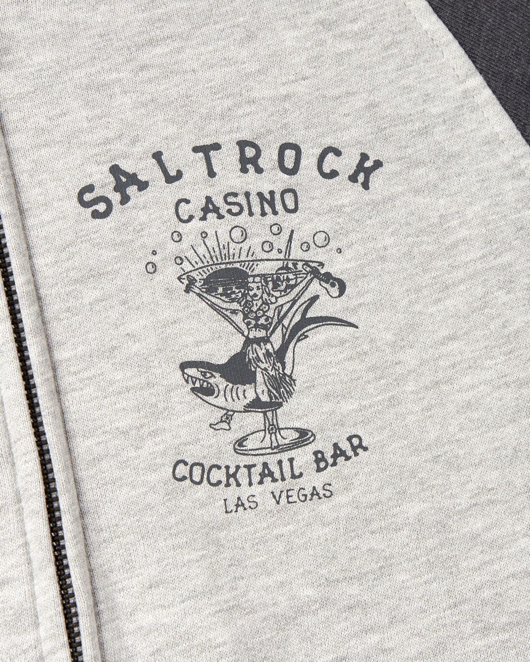 Gray fabric with a "Vegas Cocktail Saltrock" printed logo, featuring an illustration of a cocktail glass and Saltrock branded graphics.