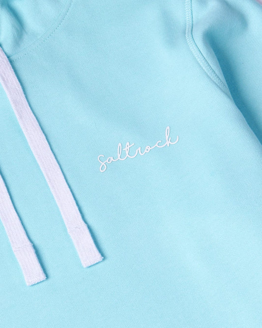 A close-up view of a Velator - Womens Pop Hoodie - Light Blue with Saltrock branding, embroidered in cursive and two white drawstrings.