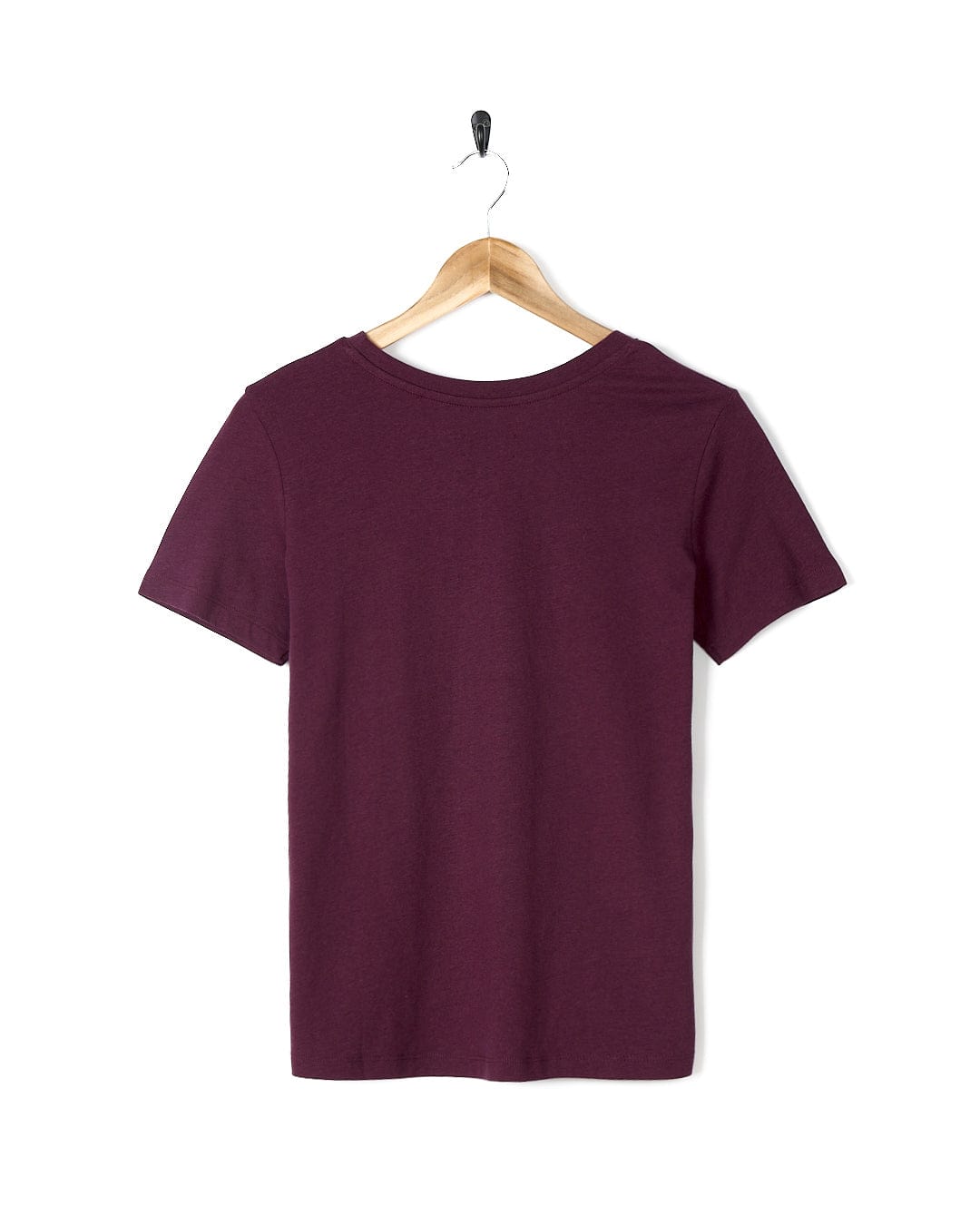 A Saltrock Velator - Womens Short Sleeve T-Shirt - Dark Purple hanging on a wooden hanger.