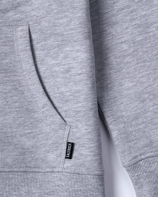Close-up of a gray Velator - Womens Zip Hoodie with a side pocket and Saltrock branding.