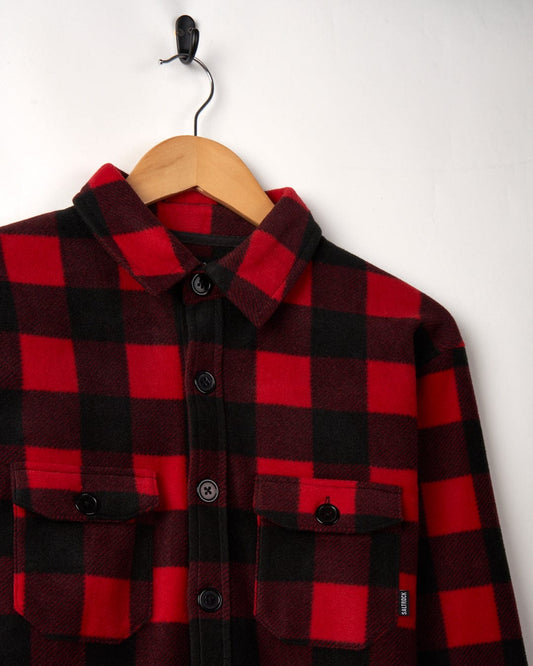 Waldron - Mens Long Sleeve Shirt - Red/black check shirt by Saltrock hanging on a wooden hanger against a white background.