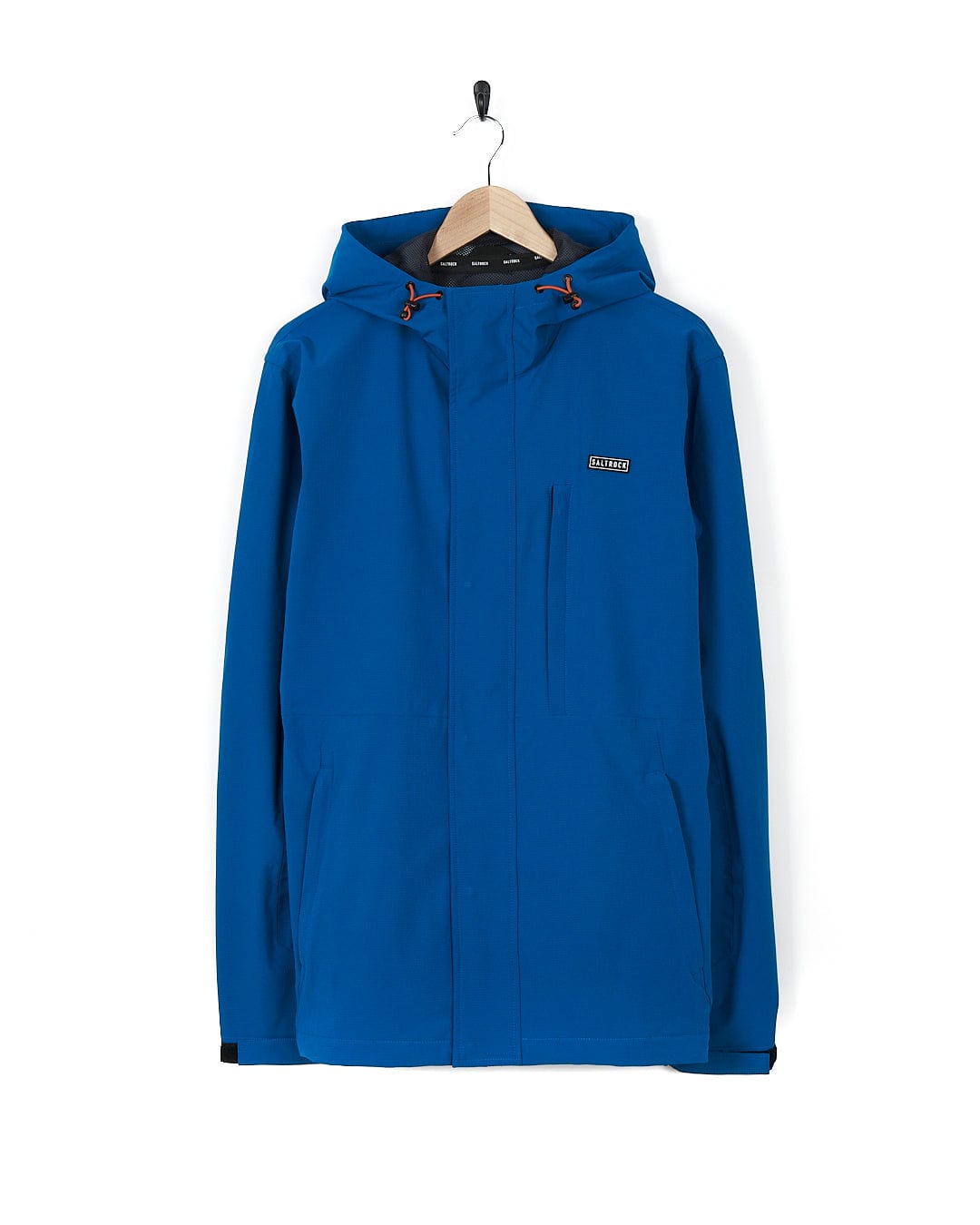 A Saltrock Whistler - Mens Hooded Jacket - Blue hanging on a hanger.