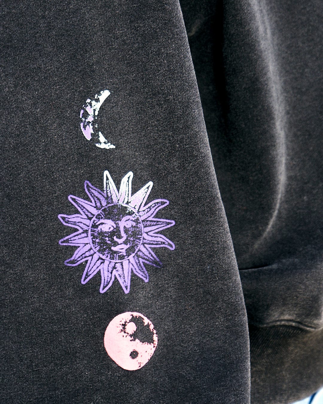 A Saltrock women's sweatshirt featuring a celestial design of sun, moon, and stars, perfect for the Winter Solstice Gradient - Womens Sweat - Washed Black.