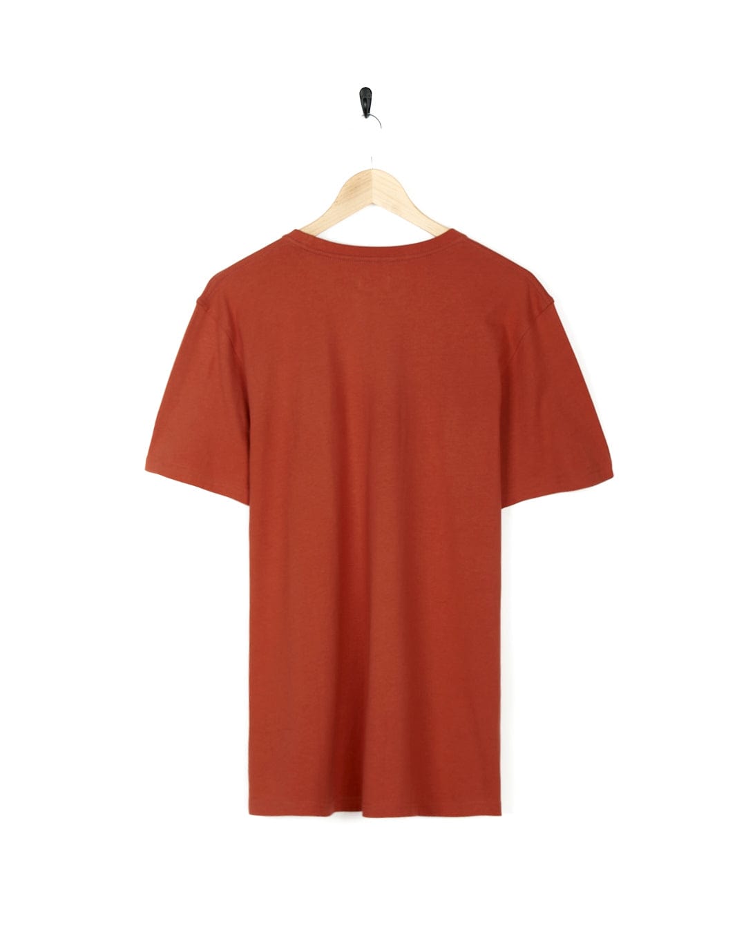 A stylish Saltrock Wood Carve Logo - Mens Short Sleeve T-Shirt - Red hanging on a wooden hanger.
