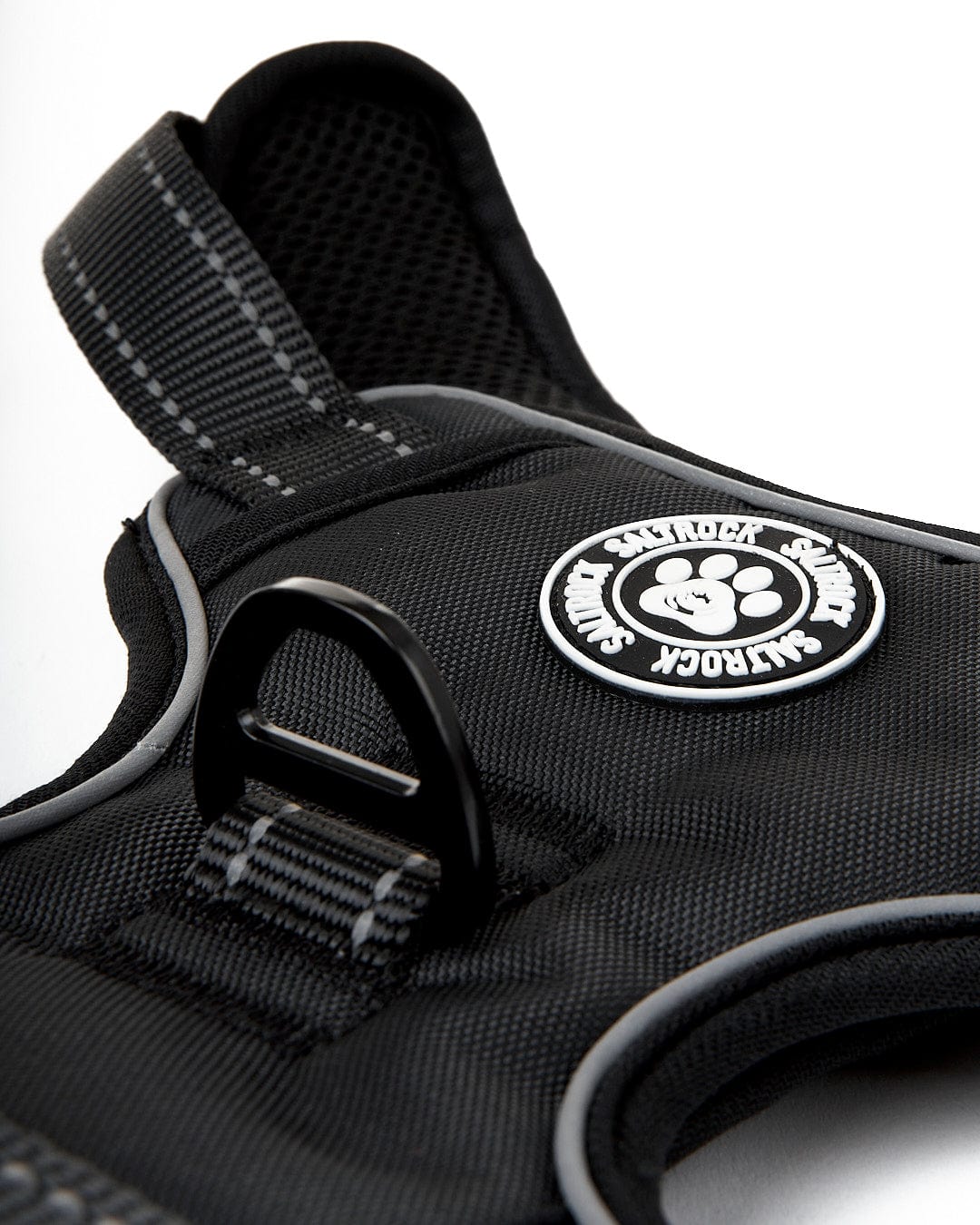 An adjustable Saltrock Pet Harness in black with a logo on it.