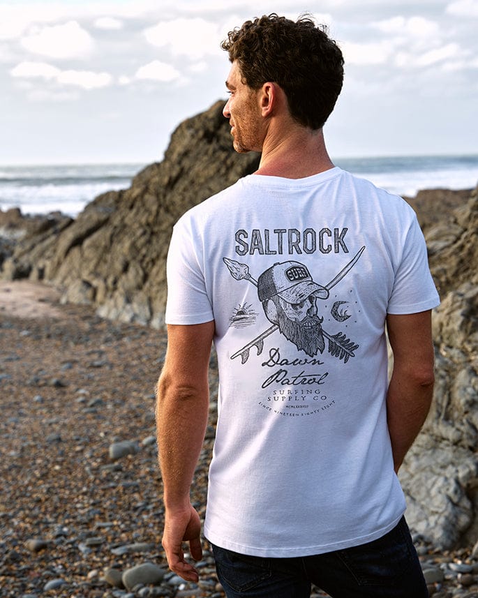 A man wearing a Saltrock - Dawn Patrol Mens Short Sleeve T-Shirt - White.