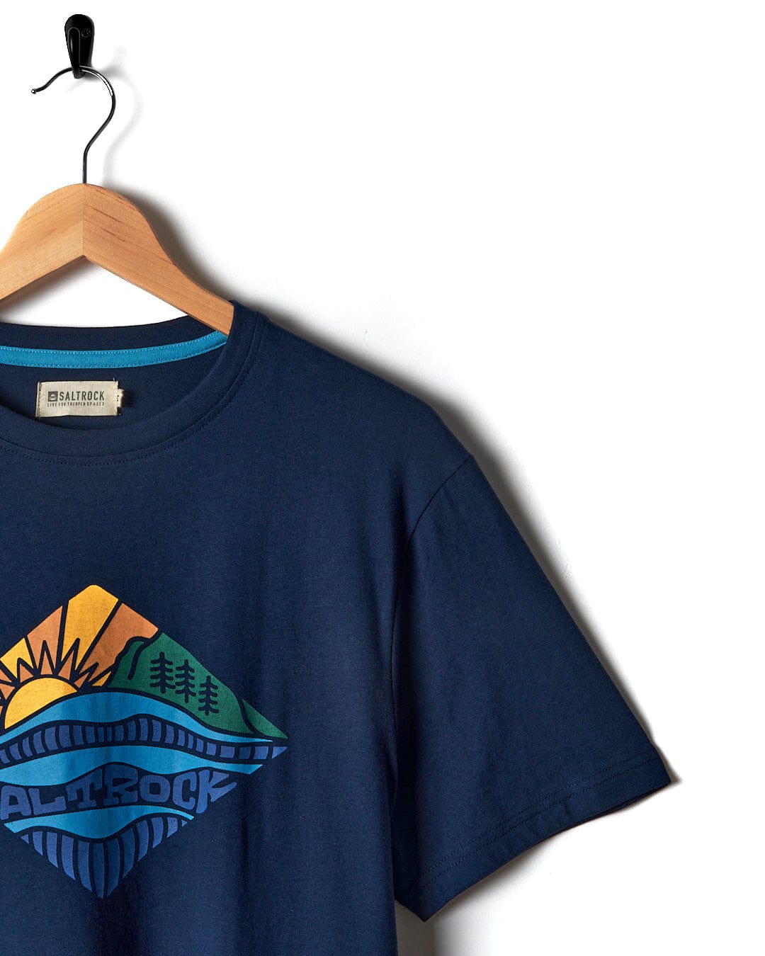 A Saltrock Diamond Scene - Mens Short Sleeve T-Shirt - Blue with an image of mountains and a sun.