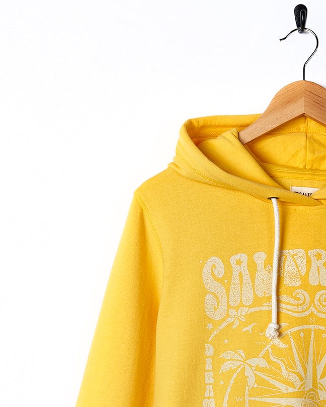 A Dreamseeker - Womens Pop Hoodie - Yellow hangs on a hanger. (Brand Name: Saltrock)