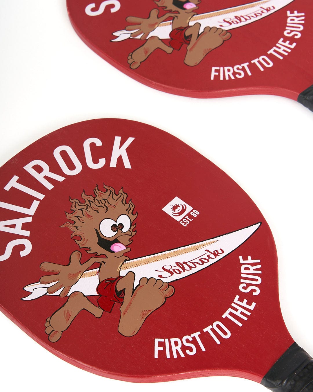 A red paddle with the words Saltrock Running Man - Bat And Ball - Red to the surf.