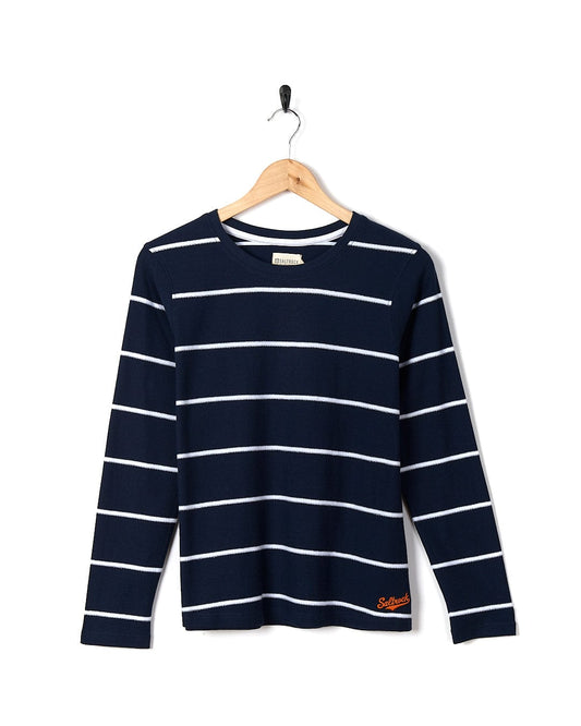 Navy blue and white Saltrock Hartland women's striped long-sleeve t-shirt hanging on a hanger against a white background.