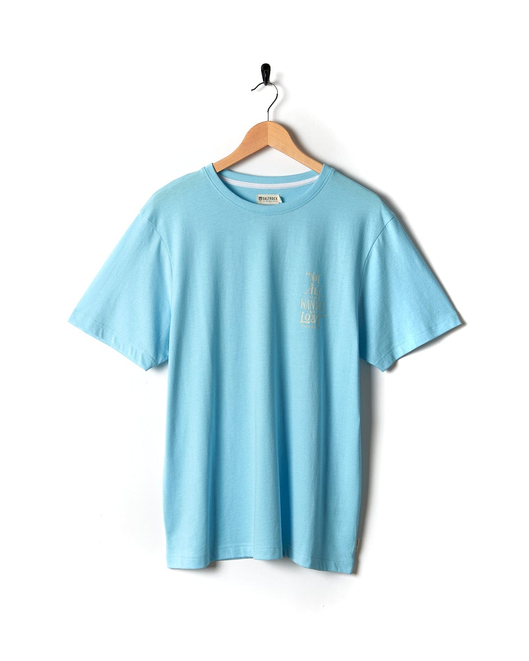 A light blue Lost Ships - Mens Short Sleeve T-Shirt in Turquoise hanging on a wooden hanger. (Saltrock)