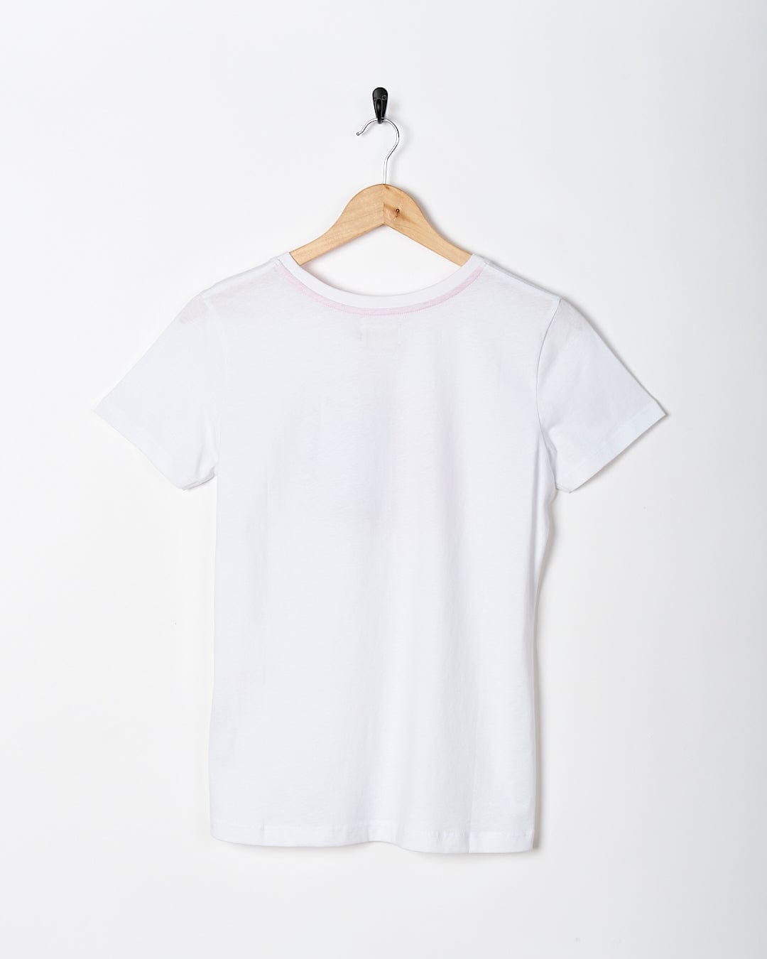 A Saltrock Love Your Ocean - Womens Short Sleeve T-Shirt - White hanging on a white wall.