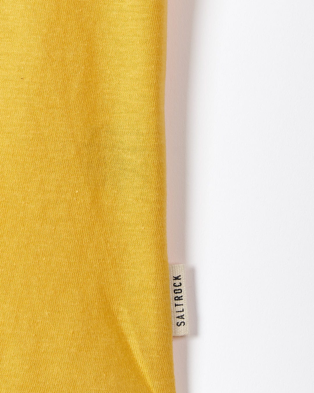 A Saltrock yellow t-shirt with the On The Road Wales - Womens Short Sleeve T-Shirt - Yellow label on it.