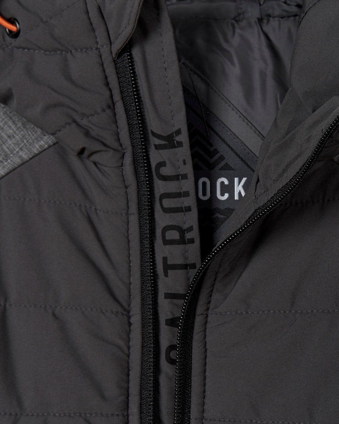 An image of a Saltrock Purbeck Padded Jacket with the words 'outtrck' on it.