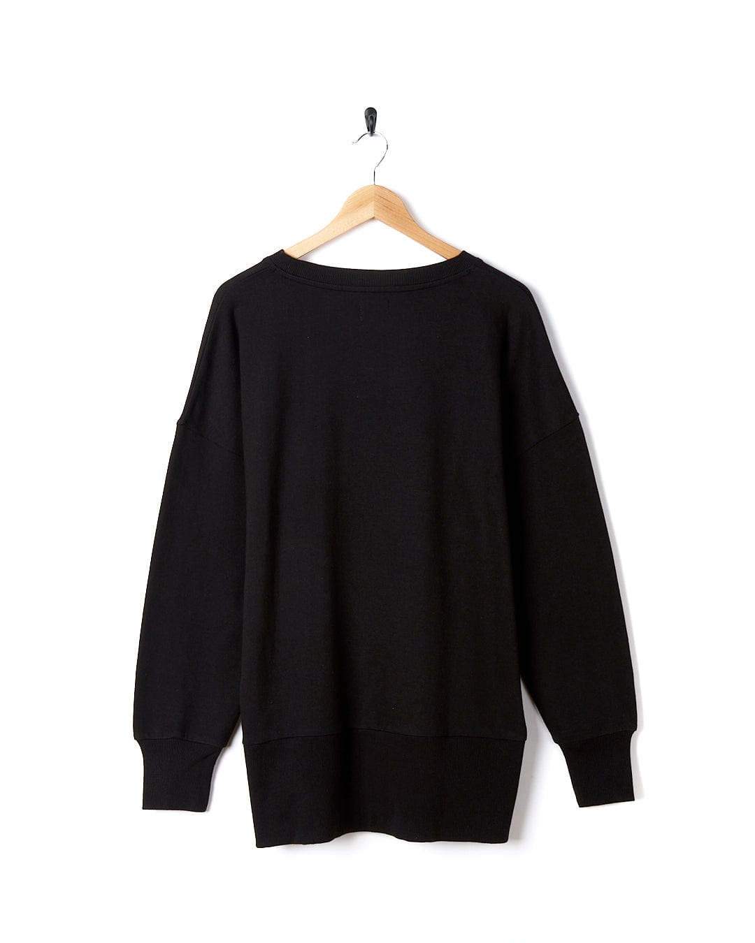A Saltrock Purfect Wave Gradient - Womens Boyfriend Fit Sweat - Black hanging on a hanger.