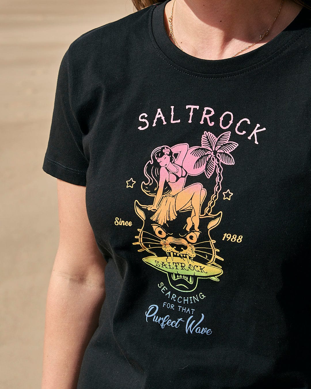 A woman wearing a Saltrock Purfect Wave Gradient - Womens Short Sleeve T-Shirt - Black.