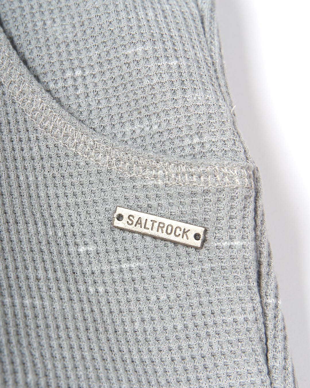 A close up of a Rosalin - Womens Sweat Short - Light Grey with the word Saltrock on it.