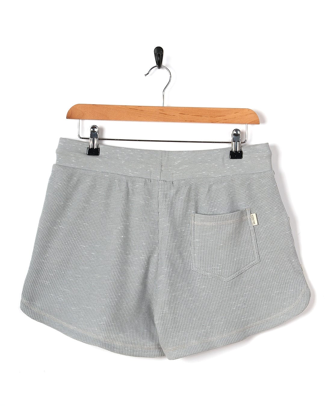 A Rosalin - Womens Sweat Short - Light Grey by Saltrock hanging on a hanger.