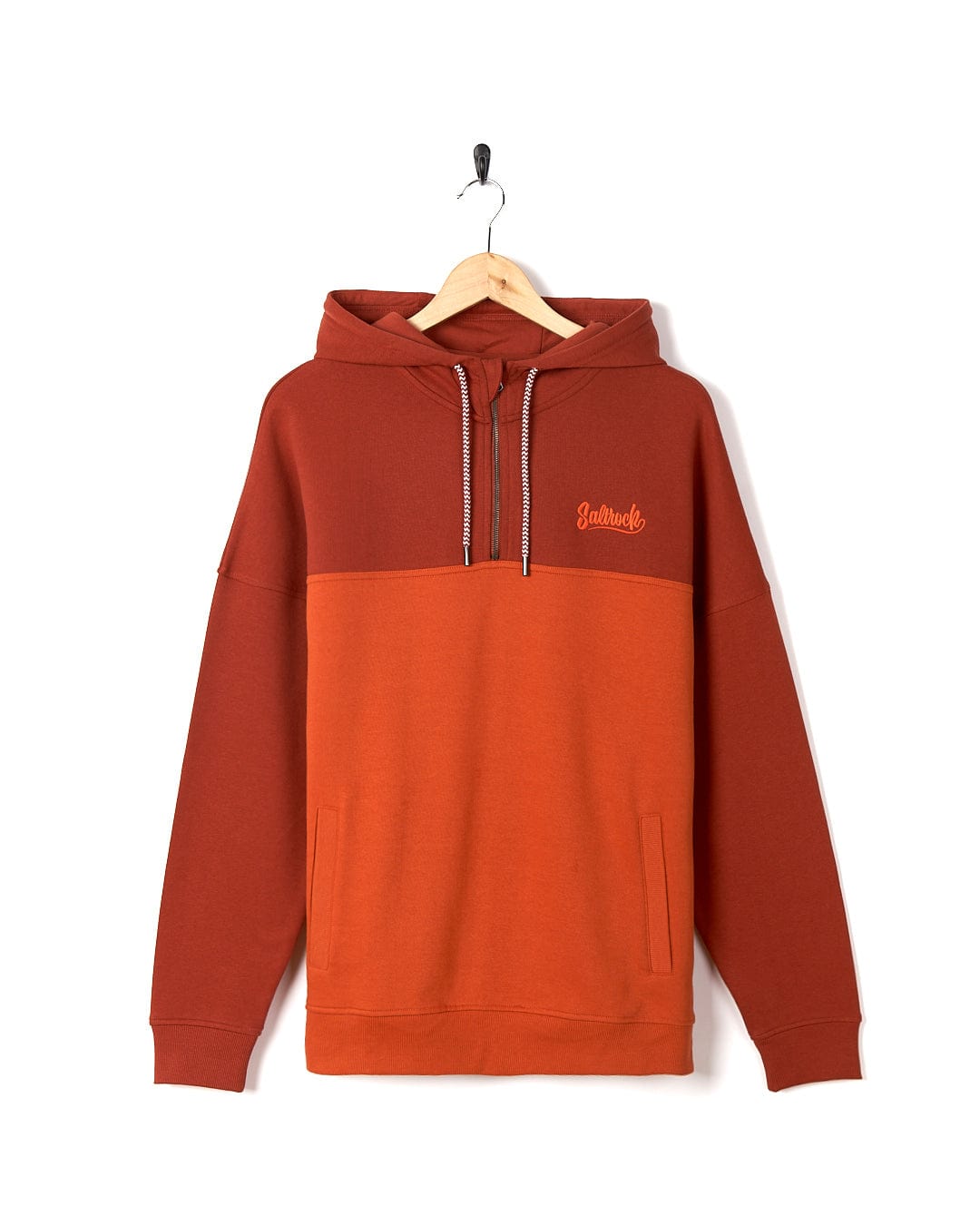 A Saltrock Speed Embroidery - Men's 1/4 Neck Zip - Red hoodie hanging on a hanger.