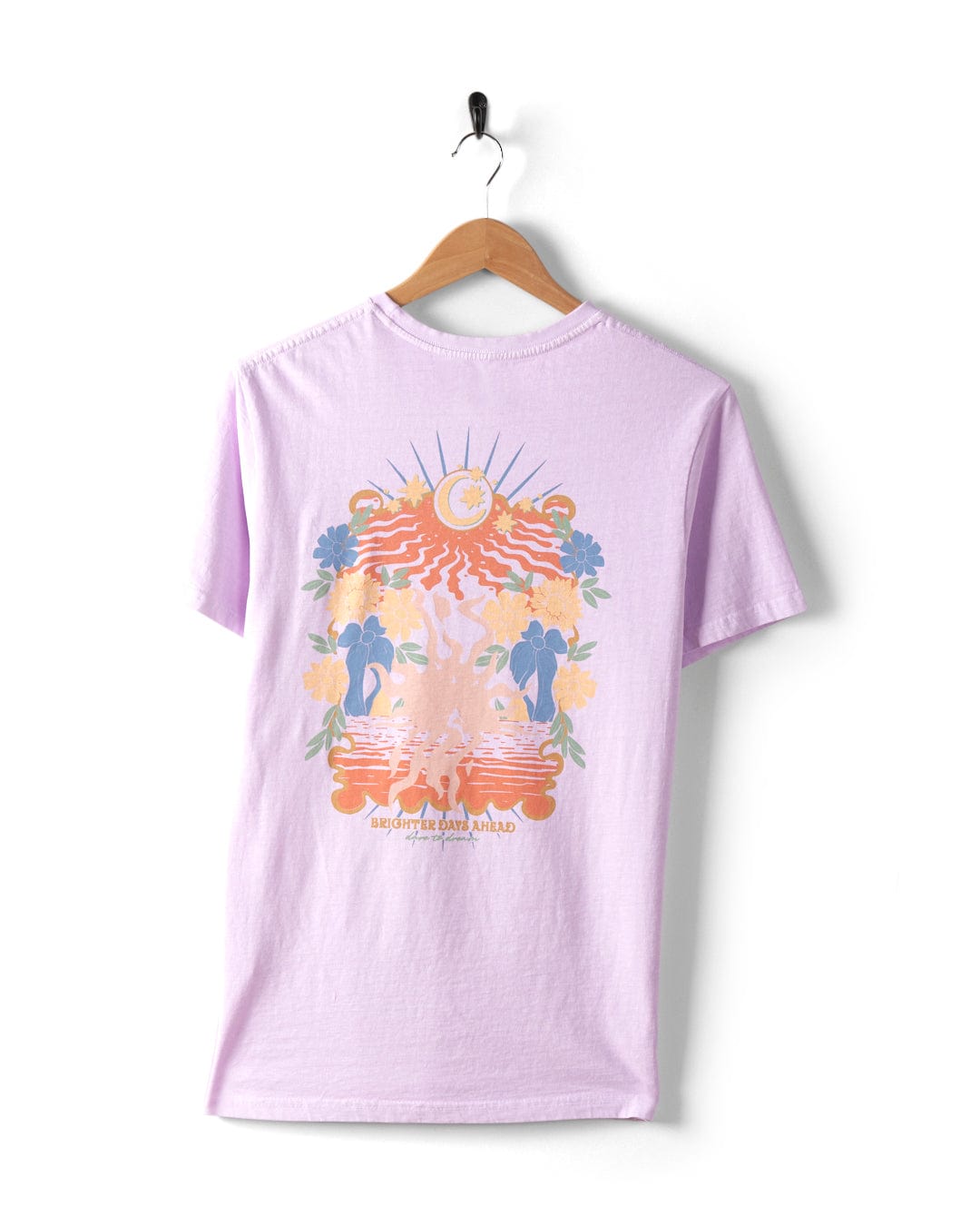 This Saltrock Better Days women's t-shirt, crafted from 100% cotton in a refreshing pink hue, showcases vibrant graphics depicting an ocean scene with the sun, moon, and tropical elements. Perfectly displayed on a hanger, this crew fit tee effortlessly embodies the essence of beachside relaxation.