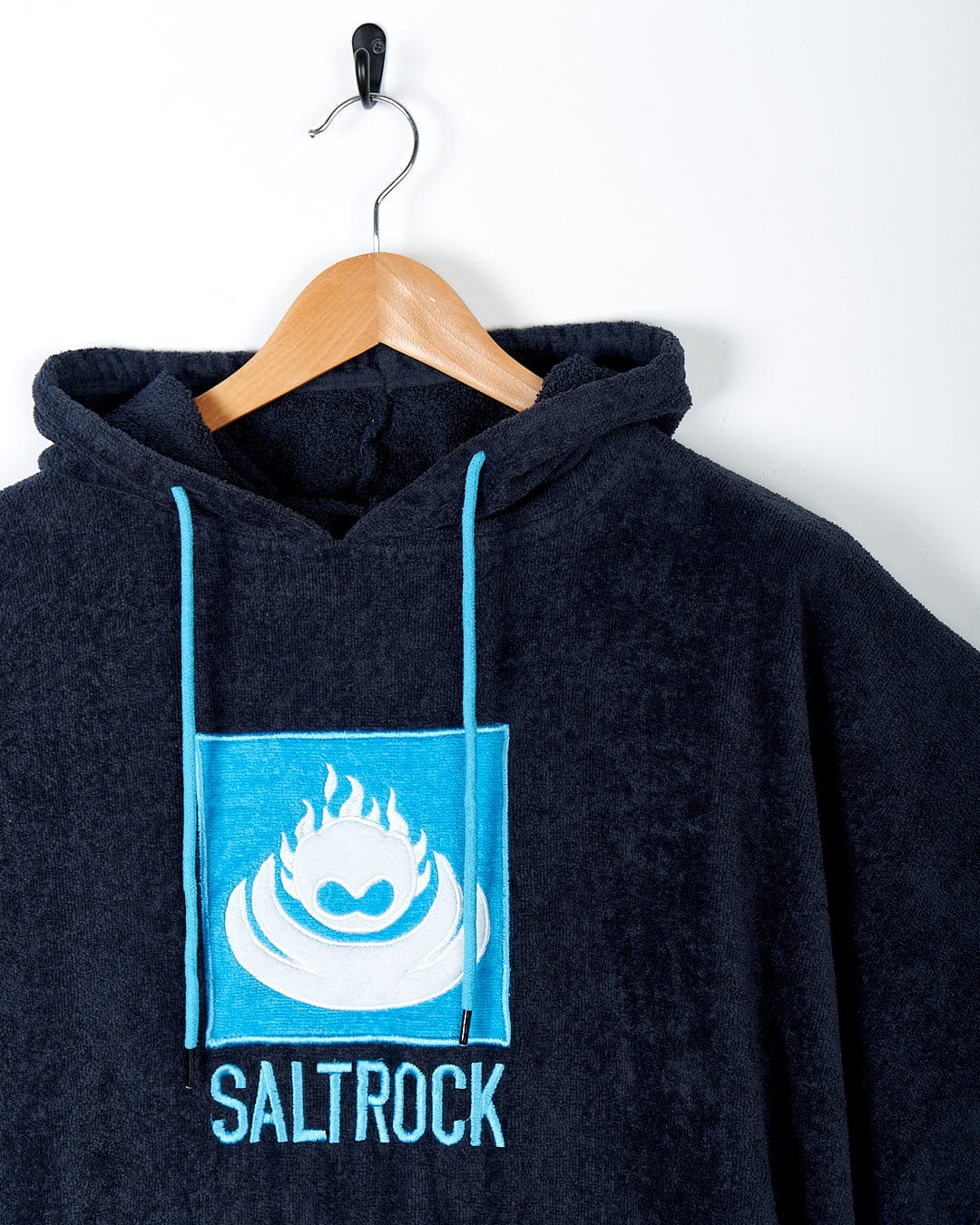 A quick-drying Corp - Changing Towel - Blue hoodie with the brand name Saltrock on it.