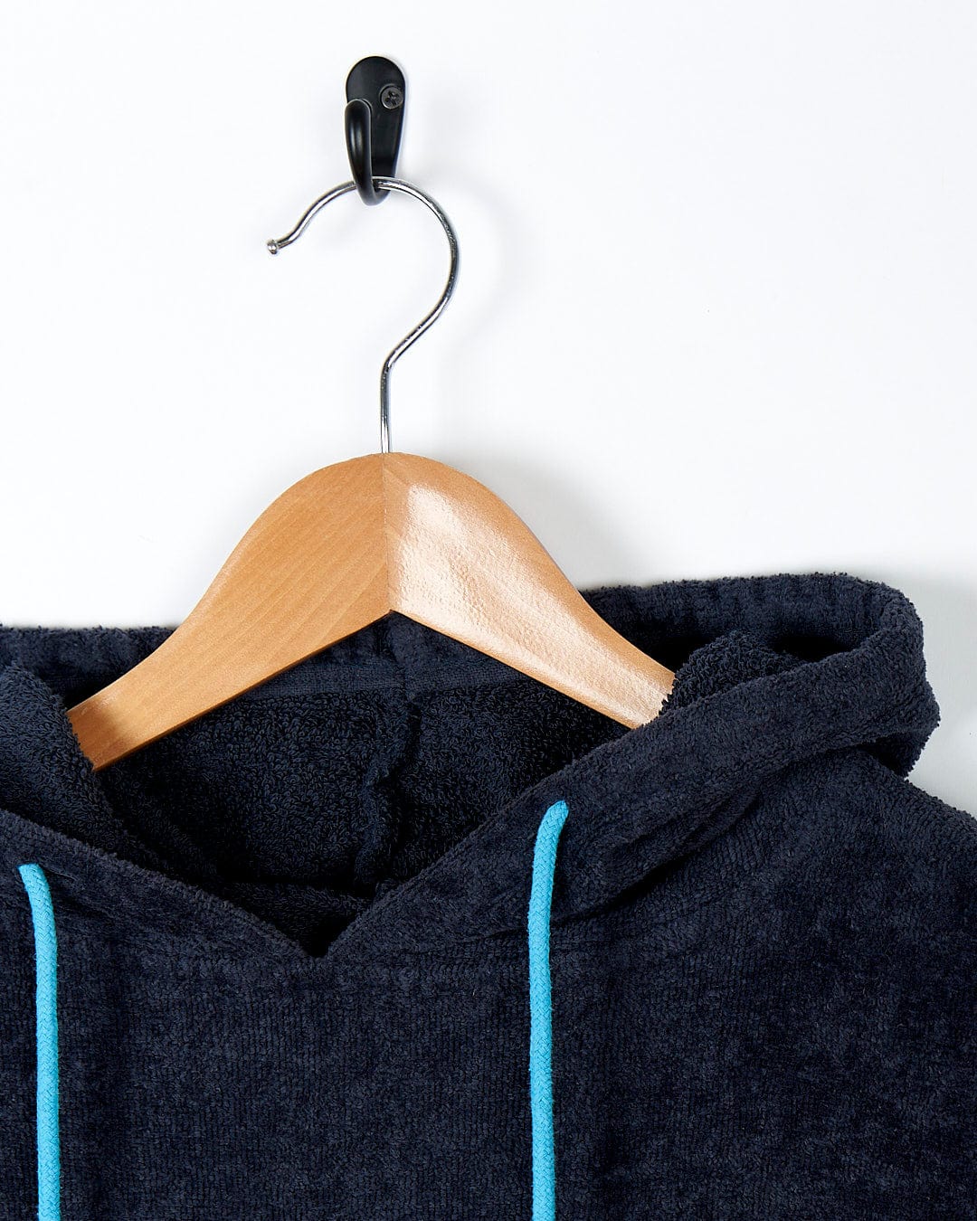 An ultra-absorbent Saltrock - Changing Towel - Blue hoodie.
