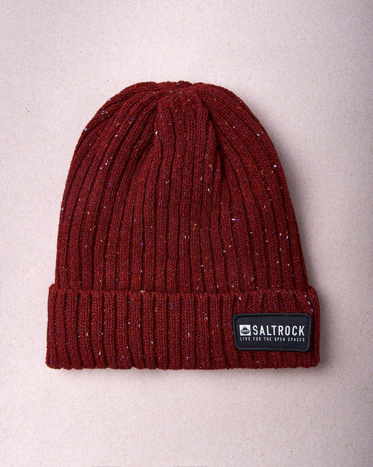 A Heritage - Beanie - Red with a Saltrock label on it.