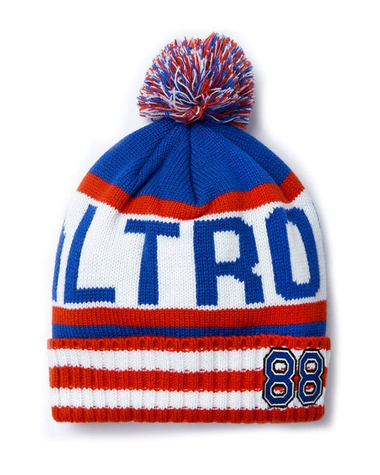 An Apres - Beanie - Blue with the word 'altro' on it, featuring a pom pom and Saltrock branding.