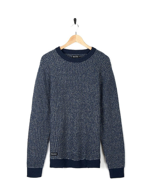 A Saltrock - Mens Crew Knit - Dark Blue sweater hanging on a hanger.