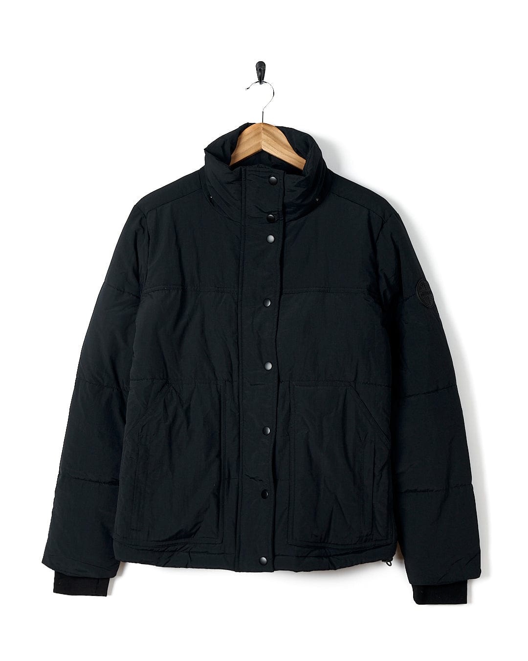 A Saltrock Aspen - Womens Short Puffer Jacket - Black with a detachable hood.