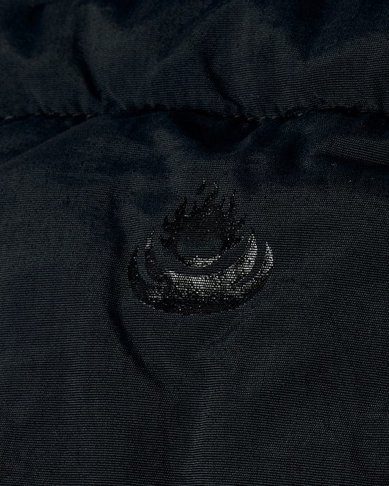 A close up of a Saltrock Aspen - Womens Short Puffer Jacket - Black with a padded material.