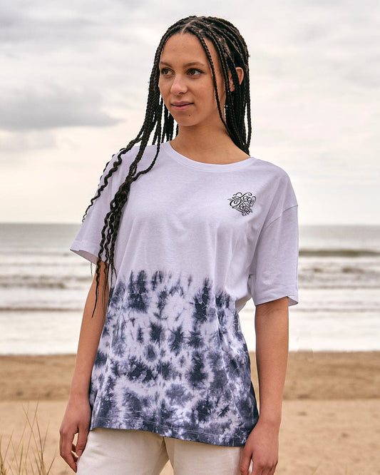 A woman wearing an Astra - Womens Short Sleeve T-Shirt - White by Saltrock on the beach.