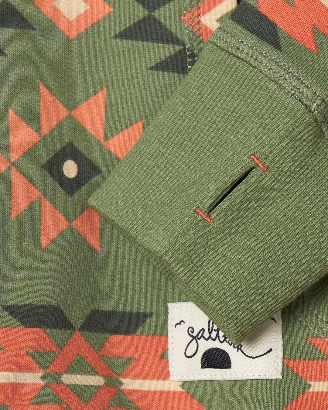 A close up of a Aztec Santano - Womens Pop Hoodie in Green/Orange from Saltrock, made of soft cotton fabric.