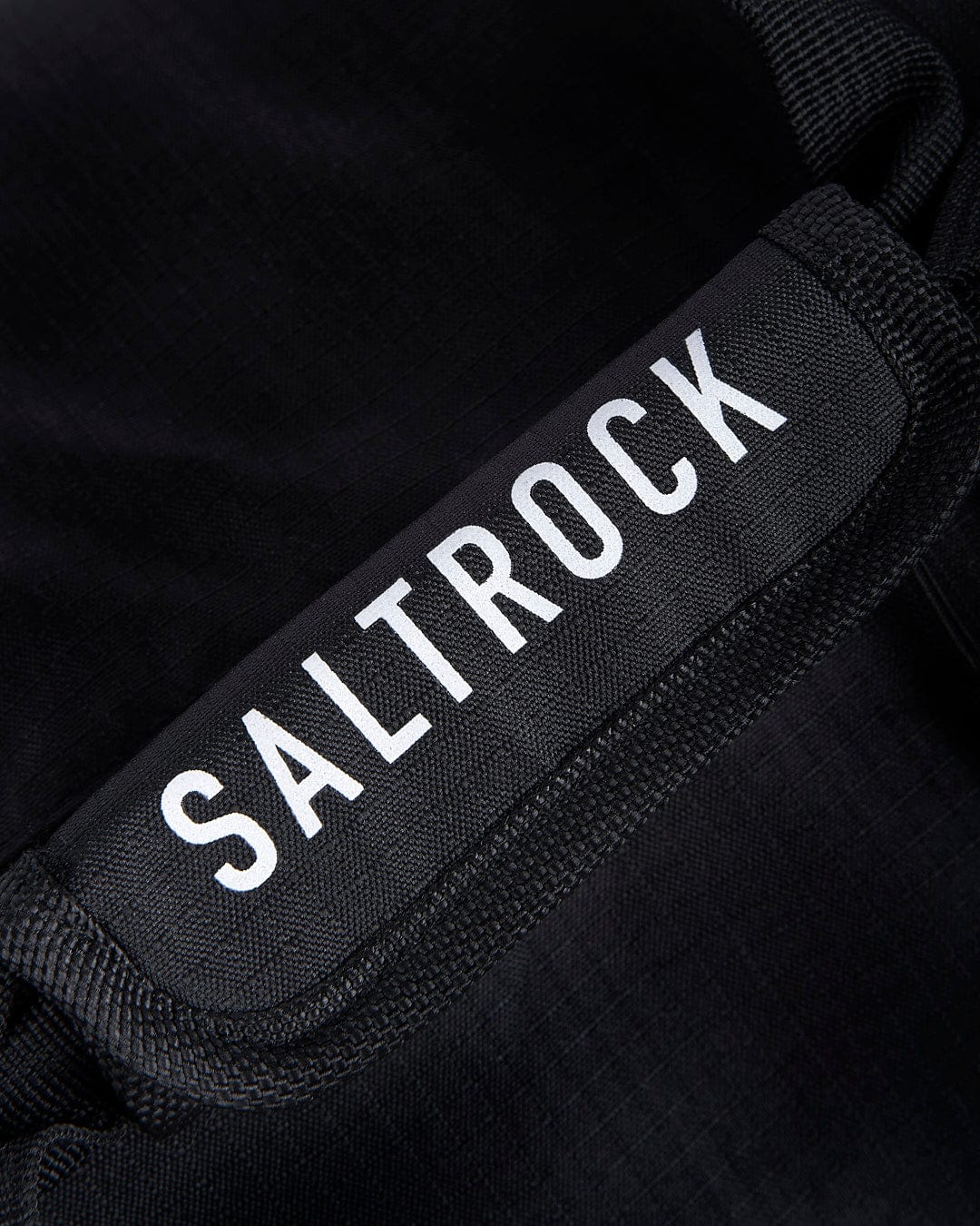 A close up of a Saltrock bag with the word Balboa - Holdall - Black on it.