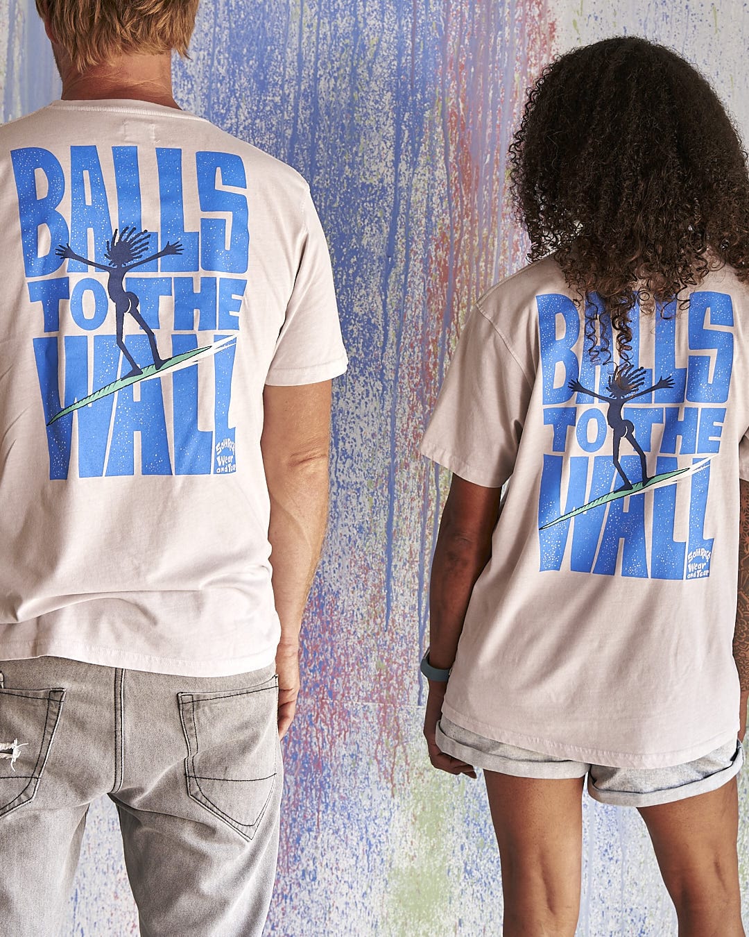 Two people wearing Saltrock t-shirts that say Balls To The Wall - Limited Edition 35 Years T-Shirt.