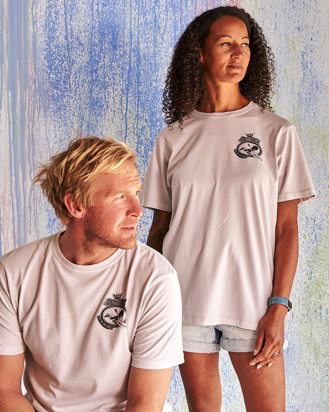 A man and a woman wearing Saltrock's Balls To The Wall - Limited Edition 35 Years T-Shirt.