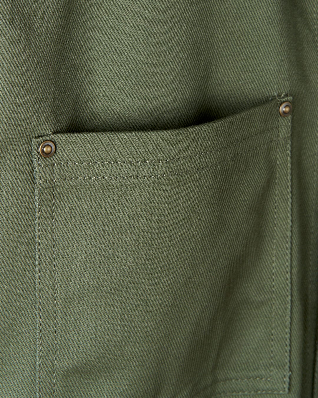 A close up of a Saltrock Barden - Womens Lightweight Utility Jacket - Dark Green cotton twill pocket on a jacket.