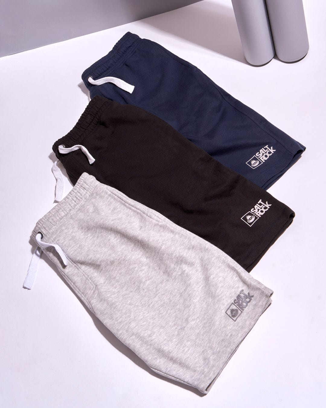 A group of Saltrock Original 20 - Mens Sweat Shorts - Blue Marl on a white surface featuring contrasting draw cords and elasticated waist.