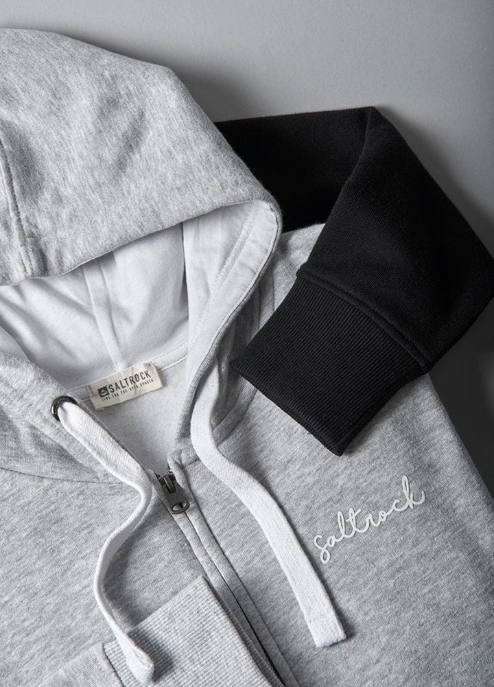 A staple wardrobe essential, the Saltrock Velator - Womens Zip Hoodie - Grey features Saltrock branding and is designed with a black hoodie layered over a grey hoodie.