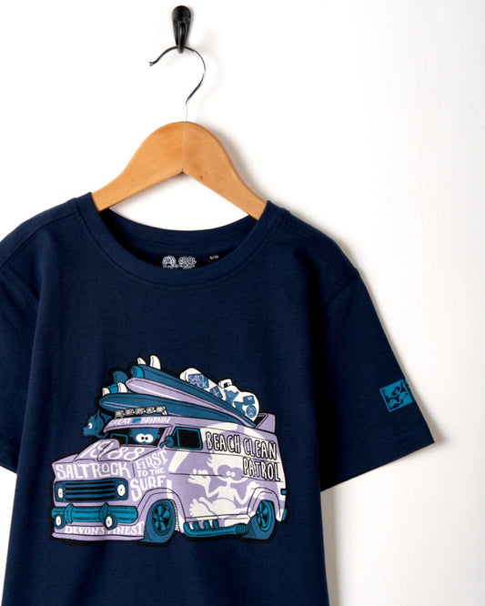 A Beach Patrol - Kids Short Sleeve T-Shirt - Blue featuring a campervan with a surfboard on it by Saltrock.
