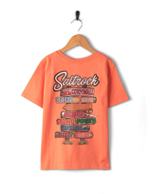 A 100% Cotton orange t-shirt with Beach Signs Cornwall and Cornwall beach signs on it from Saltrock.
