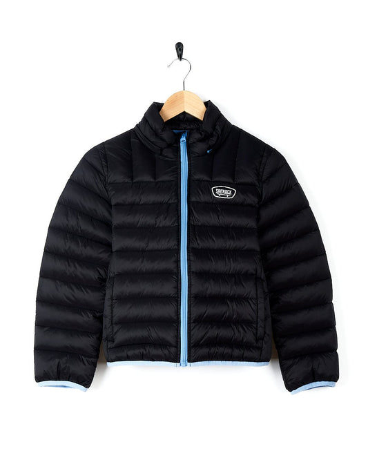 A Saltrock - Beau Kids Puffer Jacket - Dark Blue with a detachable hood hanging on a hanger.